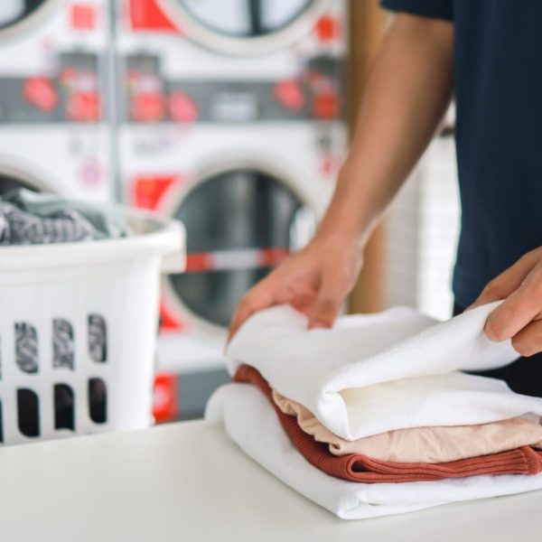 House husband with Basket and dirty laundry washed clothing in
